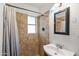 Bathroom featuring a shower with tile surround, vanity and neutral finishes at 5137 N 20Th Ave, Phoenix, AZ 85015