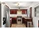Efficient kitchen with stainless steel appliances, tile flooring and sleek countertops at 5137 N 20Th Ave, Phoenix, AZ 85015