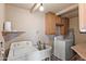 Laundry room featuring washer, dryer, and storage cabinets at 5137 N 20Th Ave, Phoenix, AZ 85015