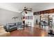 Open-concept living room with hardwood floors that leads to a dining room area at 5137 N 20Th Ave, Phoenix, AZ 85015