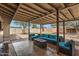 Covered patio featuring comfortable seating, a fire pit, and a view of the backyard at 5137 N 20Th Ave, Phoenix, AZ 85015