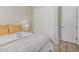 Bright bedroom with hardwood floors and sliding closet doors at 5653 E Sayan St, Mesa, AZ 85215
