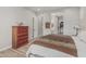 Spacious bedroom with wood floors, en-suite bathroom, and walk-in closet at 5653 E Sayan St, Mesa, AZ 85215