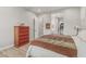 Bright bedroom with hardwood floors opens up to an ensuite bathroom and walk-in closet at 5653 E Sayan St, Mesa, AZ 85215