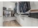 Walk-in closet features built-in shelving and hardwood floors at 5653 E Sayan St, Mesa, AZ 85215