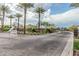 Scenic community entrance featuring manicured landscaping, mature trees and attractive signage at 5653 E Sayan St, Mesa, AZ 85215