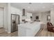 Bright kitchen with a large center island, stainless steel appliances, and plenty of cabinet space at 5653 E Sayan St, Mesa, AZ 85215