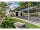 Spacious outdoor area with covered structures, manicured lawn, and recreational space for gatherings at 5653 E Sayan St, Mesa, AZ 85215