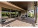 Covered patio with pavers, outdoor seating, and sliding glass doors for easy indoor-outdoor flow at 5653 E Sayan St, Mesa, AZ 85215
