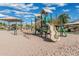 Colorful playground with slides, climbing structures, and a covered picnic area for Gathering fun at 5653 E Sayan St, Mesa, AZ 85215