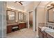 A bathroom with double sinks and vanities and a separate water closet at 5690 E Canyon Creek Cir, Carefree, AZ 85377