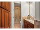 Bathroom with vanity and granite countertop and walk-in shower visible through door at 5690 E Canyon Creek Cir, Carefree, AZ 85377