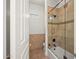 Bathroom featuring tiled shower with glass door and updated fixtures at 5690 E Canyon Creek Cir, Carefree, AZ 85377