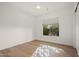 Bright, naturally-lit bedroom with hardwood floors and a large window at 5690 E Canyon Creek Cir, Carefree, AZ 85377
