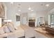 A bedroom with a large bed, dresser with television, and sitting area at 5690 E Canyon Creek Cir, Carefree, AZ 85377