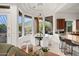 Sun-filled dining area with panoramic views and access to the outdoor patio with a pool at 5690 E Canyon Creek Cir, Carefree, AZ 85377