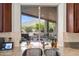 Kitchen sink view showcasing the backyard patio and mountain views beyond at 5690 E Canyon Creek Cir, Carefree, AZ 85377