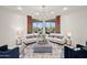 Bright living room featuring stylish furnishings, large windows, and scenic views at 5690 E Canyon Creek Cir, Carefree, AZ 85377