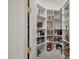Walk-in pantry with ample shelving, perfect for storing groceries and kitchen essentials at 5690 E Canyon Creek Cir, Carefree, AZ 85377