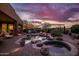 Luxury outdoor pool area with a spa, fire features, built-in grill, desert landscaping, and scenic views at 5690 E Canyon Creek Cir, Carefree, AZ 85377