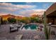 Beautiful backyard pool surrounded by lush desert landscape with mountain views at 5690 E Canyon Creek Cir, Carefree, AZ 85377