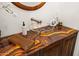 Close-up of the bathroom vanity featuring a unique glass sink and striking countertop at 5690 E Canyon Creek Cir, Carefree, AZ 85377