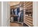 A walk-in closet with rods for hanging and shelves for clothing and hats at 5690 E Canyon Creek Cir, Carefree, AZ 85377