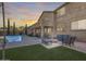 Backyard with covered patio, pool, and firepit, providing a relaxing outdoor living space at 5826 W Plum Rd, Phoenix, AZ 85083