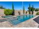Inviting backyard pool and spa surrounded by lush landscaping and a serene desert ambiance at 5826 W Plum Rd, Phoenix, AZ 85083