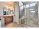 Bathroom showcasing a glass-enclosed shower with tile surround, built-in bench, and neutral colors for a spa-like feel at 5826 W Plum Rd, Phoenix, AZ 85083
