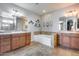 Bathroom features a large tub, double sinks, and lots of cabinet space at 5826 W Plum Rd, Phoenix, AZ 85083