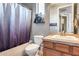 Bathroom featuring a shower and bath, as well as a white sink and vanity at 5826 W Plum Rd, Phoenix, AZ 85083