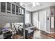 This bedroom features a loft bed, a sleeper sofa, and wood-look floors at 5826 W Plum Rd, Phoenix, AZ 85083
