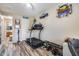 This exercise room has a door to the bathroom and weight equipment for a convenient and effective workout at 5826 W Plum Rd, Phoenix, AZ 85083