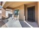 Cozy front porch with white rocking chairs and a view of the neighborhood at 5826 W Plum Rd, Phoenix, AZ 85083