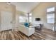 Bright and airy living room featuring a vaulted ceiling, stylish seating, and plenty of natural light at 5826 W Plum Rd, Phoenix, AZ 85083