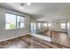 An open concept loft area overlooking living room featuring updated railing and floors at 5826 W Plum Rd, Phoenix, AZ 85083