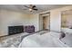 This main bedroom has a walk-in closet, jacuzzi tub, and dark wood floors at 5826 W Plum Rd, Phoenix, AZ 85083