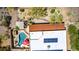 A bird's eye view shows a home with a solar panel roof, a pool, and desert landscaping at 5978 E Chuckwalla Trl, Cave Creek, AZ 85331
