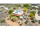 Aerial shot of desert home with a pool, solar panels and stunning views of the surrounding landscape at 5978 E Chuckwalla Trl, Cave Creek, AZ 85331