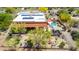 Desert home features a pool, solar panels, outdoor firepit, a pergola, and desert landscaping at 5978 E Chuckwalla Trl, Cave Creek, AZ 85331