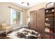 This bedroom features a murphy bed, stylish decor, and views of the desert landscape at 5978 E Chuckwalla Trl, Cave Creek, AZ 85331