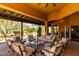 Spacious covered patio with comfortable seating, offering a seamless transition between indoor and outdoor living spaces at 5978 E Chuckwalla Trl, Cave Creek, AZ 85331