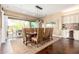 Spacious dining room with hardwood floors, stylish lighting, and easy access to the backyard patio at 5978 E Chuckwalla Trl, Cave Creek, AZ 85331