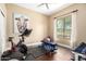 Bright room featuring an exercise bike, weight bench, and scenic outdoor views at 5978 E Chuckwalla Trl, Cave Creek, AZ 85331