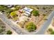 Aerial view of a home that features a two car garage, desert landscaping, and solar panel roof in desert landscape at 5978 E Chuckwalla Trl, Cave Creek, AZ 85331