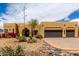 Charming home featuring a desert landscape, attached two-car garage, and barrel tile roofing at 5978 E Chuckwalla Trl, Cave Creek, AZ 85331