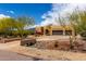 Charming home featuring desert landscape with mature trees, and an attached two-car garage at 5978 E Chuckwalla Trl, Cave Creek, AZ 85331