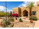 Charming home featuring desert landscaping with vibrant flowers and mature cacti at 5978 E Chuckwalla Trl, Cave Creek, AZ 85331