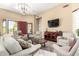 Bright living room with dark wood floors, neutral paint, and a statement light fixture at 5978 E Chuckwalla Trl, Cave Creek, AZ 85331